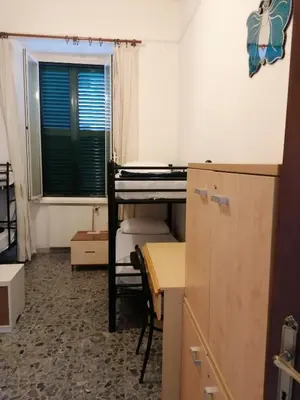 a room with a desk and a table and a window at Dream Destination Rome in Rome