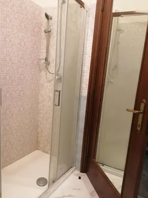 a shower with a glass door in a bathroom at Dream Destination Rome in Rome