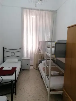 a room with three bunk beds and a window at Dream Destination Rome in Rome