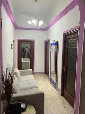 a living room with two white couches and a mirror at Dream Destination Rome in Rome
