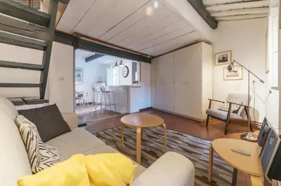 a living room with a couch and a table at GuestHost - Charming Loft Navona in Rome