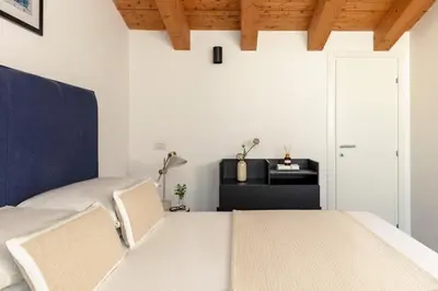 a living room with a table and a bed at Bob W Rome San Lorenzo in Rome
