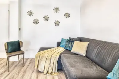 a living room with a couch and a chair at St. Peter penthouse in Rome