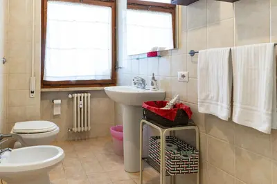 a bathroom with a sink and a toilet at Bed and Breakfast La Stazione Del Vaticano in Rome