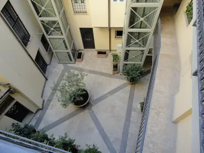 an overhead view of a courtyard in a building at Elegante appartamento immerso nei Fori Imperiali in Rome