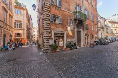 a cobblestone street in an old city with buildings at Domus Lupae -live in the heart of Rome in Rome