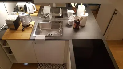a kitchen with a sink and a counter top at Domus Lupae -live in the heart of Rome in Rome