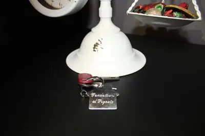 a white lamp with a bunch of keys on a table at condottieri al pigneto in Rome