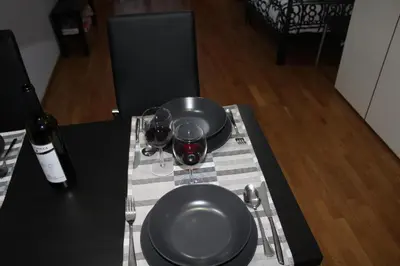 a table with two glasses of wine on a table at condottieri al pigneto in Rome