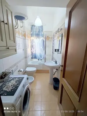 a bathroom with a washing machine and a sink at condottieri al pigneto in Rome