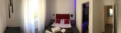 a bedroom with a bed in a room with a window at Room 76 in Rome