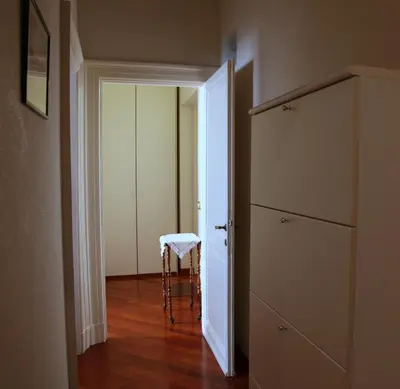 an empty hallway with a stool in a room at Apartment Spanish Steps with panoramic roof-terrace in Rome