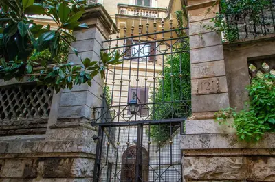 an entrance to a building with a wrought iron gate at SECRET GARDEN - Amazing Loft in The Imperial Rome in Rome