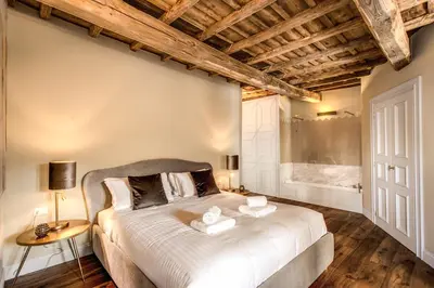a bedroom with a large bed in a room at Febo Decharm apartment in Rome