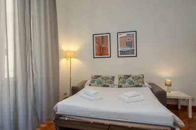 a bedroom with a bed in a room at Tizy & Toto's apartment near Vatican in Rome
