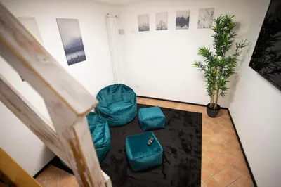 an overhead view of a living room with a couch and chairs at Sofia alla VII Coorte in Rome