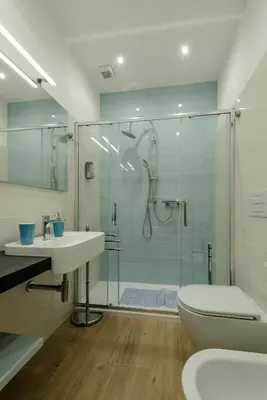 a bathroom with a shower and a sink and a toilet at Le vestali Guest House in Rome