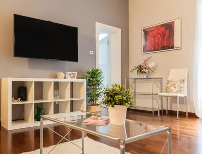 a living room with a flat screen tv on a wall at 8 HOME in Rome