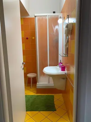 a bathroom with a sink and a shower at BREAD & BUTTER in Rome