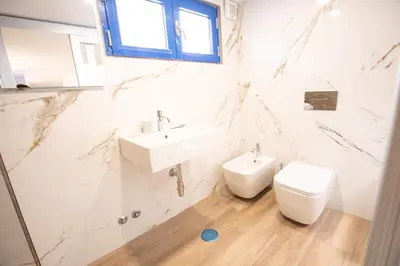 a bathroom with a shower and a sink at Spagna Lemon Suites in Rome