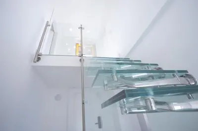 a glass staircase in a house with a glass floor at Spagna Lemon Suites in Rome
