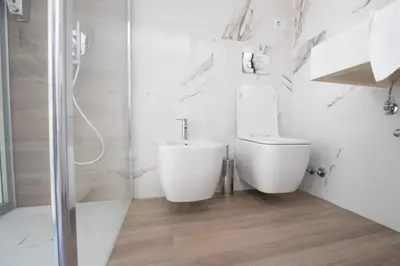 a room with a mirror and a table in a room at Spagna Lemon Suites in Rome