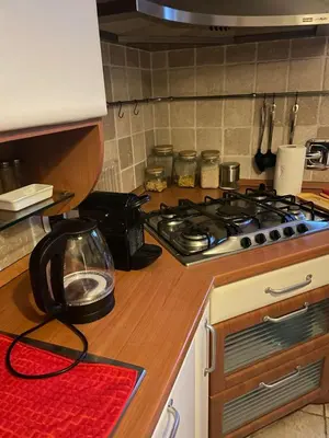 a kitchen with a stove and a counter top at OB1 Vacanze Romane in Rome
