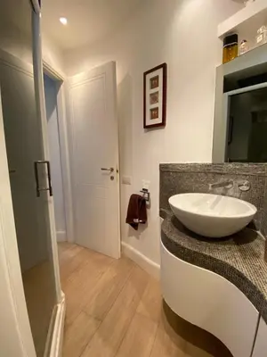 a bathroom with a white sink on a counter at OB1 Vacanze Romane in Rome