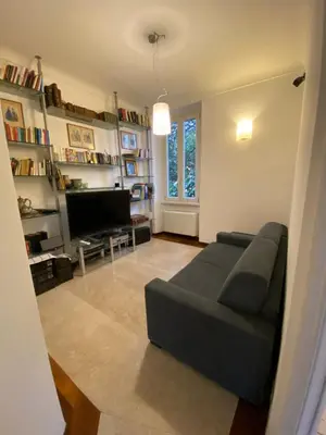a living room with a couch and a television at OB1 Vacanze Romane in Rome