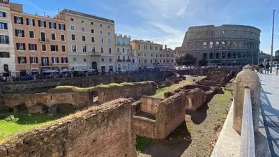 a view of a city with buildings and ruins at Tour de Rome in Rome