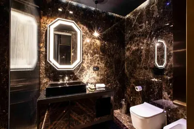 a bathroom with a sink and a mirror and a toilet at U-Visionary Roma Hotel in Rome