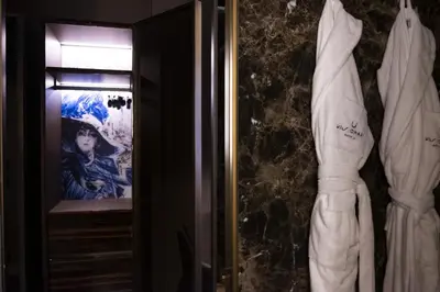 a room with a picture of a woman on the wall at U-Visionary Roma Hotel in Rome