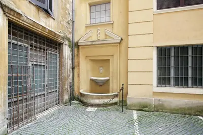 a toilet on the side of a building at La Maisonnette Tritone Trevi Apartment Rome in Rome