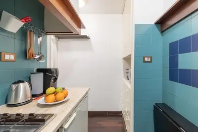 a kitchen with a plate of fruit on a counter at iFlat Colosseum Comfy House in Rome