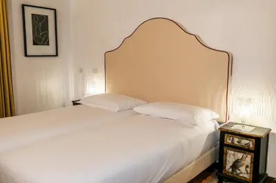 a room with yellow walls and a table and a mirror at Incentrum in Rome