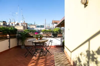 a living room with a black couch and a table at Incentrum in Rome