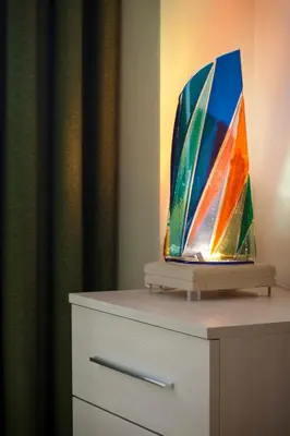 a painting of a sailboat on top of a dresser at Le Cupoline in Rome