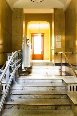 a set of stairs in a building with a window at Daffodil in Roma San Pietro in Rome