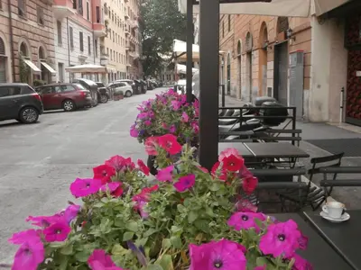 a bunch of pink flowers sitting on a table at B&B San Michele a Porta Pia in Rome