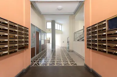 a hallway of a building with a walk in wine cellar at G&C house in Rome