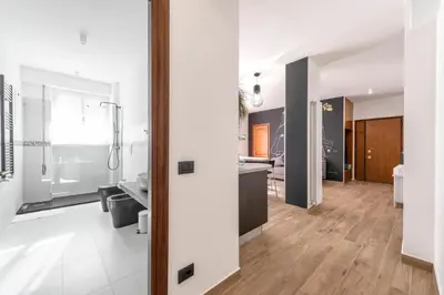 a large bathroom with a shower and a sink at G&C house in Rome