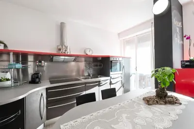 a kitchen with a table with a potted plant on it at G&C house in Rome