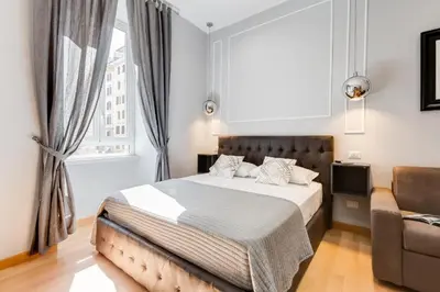 a bedroom with a bed and a couch at Vatican Prestige Apt by Premium Suites Collection in Rome