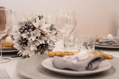 a table with plates of food and wine glasses at Sweet Arco Farnese in Rome