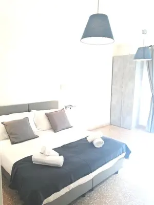 a bedroom with a large bed with towels on it at B&B Pigneto7 in Rome