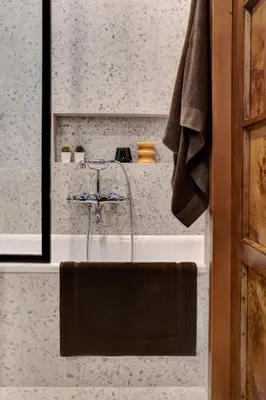 a bathroom with a sink with a towel on it at Luxury Trevi House in Rome