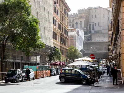 a street with cars parked on the side of the road at Vatican Apartment Santamaura in Rome