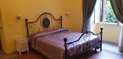 a bedroom with a bed in a room with a window at La Breccia A Porta Pia in Rome