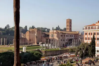 a group of people walking around a city at ROMANCE AL COLOSSEO 2 in Rome