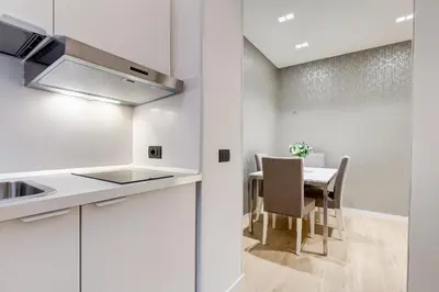 a kitchen and dining room with a table and chairs at Charming Studio - Spanish Steps in Rome